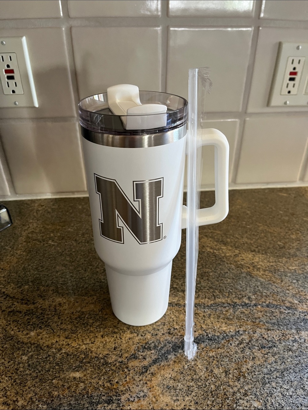 N logo Nebraska Cornhuskers stainless steel 40 oz tumbler with handle.
